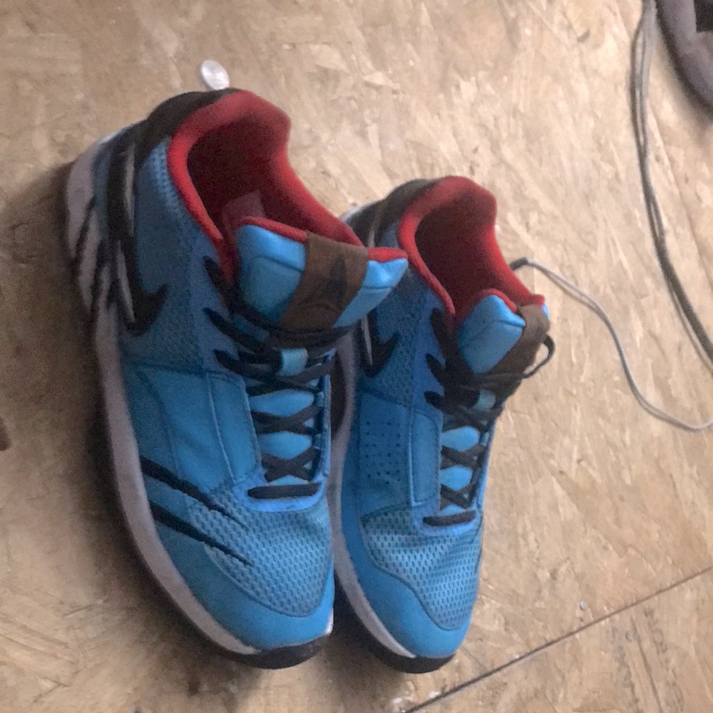 Blue and Red and black Nike shoes